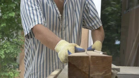 A person cuts a board on the machine Stock Footage 147554024