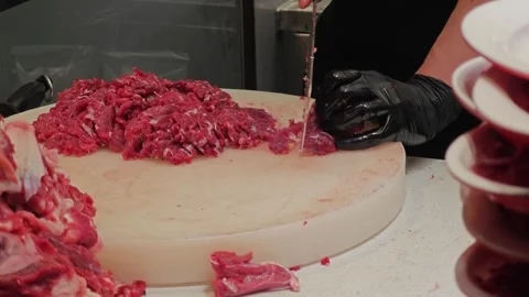 A person is cutting beef. Stock Footage 310453538