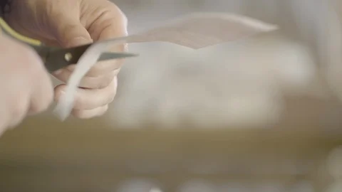 Person cutting a card with a pair of scissors Stock Footage 87614342