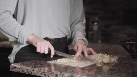 A person cutting food on a table Video stock 155455984