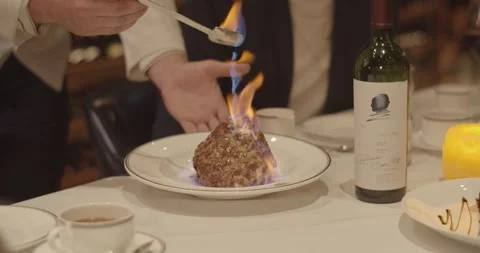 A person cutting food on a table Stock Footage 155465586