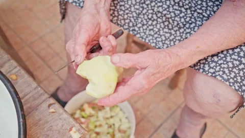 Person cutting a piece of bread 스톡 동영상 251882245