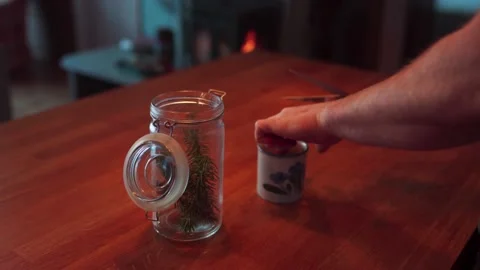 Person Cutting Pine Tree Leaves Into Cup. Making Pine Needle Tea At Home. Stock Footage 234514712
