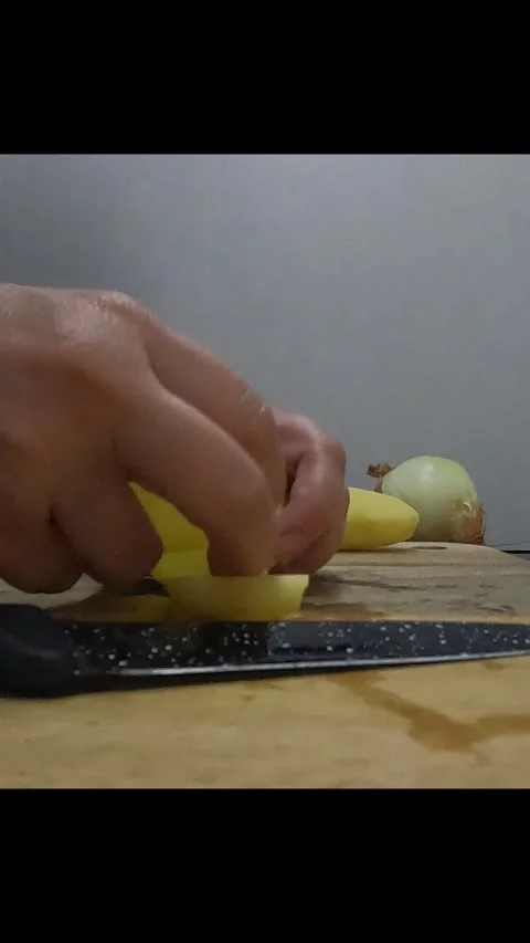 Person cutting potatoes Stock Footage 281642415