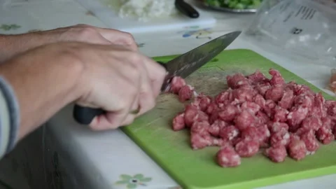 Person cutting Sausage using a Knife Stock Footage 147042965