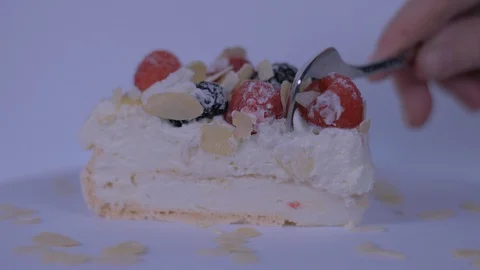 Person Cutting Slice of Cake over white background. Cake, Berries Stock-Footage 128083742