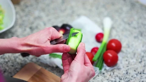 Person cutting vegetables (cucumber) Video stock 200232129
