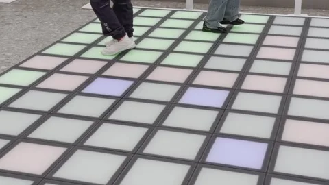 A person is dancing on a dance floor with a black and white pattern Stock Footage 279823299