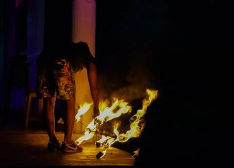 Person dancing with fire Stock Photos