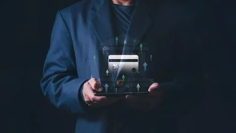 Person in dark suit using tablet with digital data Stock Photos
