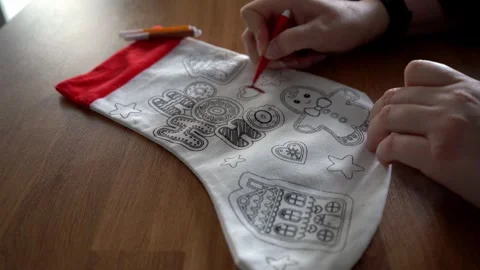 Person decorating Christmas stocking Stock Footage 323109061