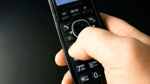 Person dials a number on the handset Stock Footage 78910422