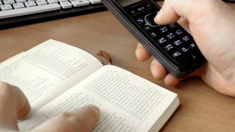Person dials a number on the handset Stock Footage 79098984