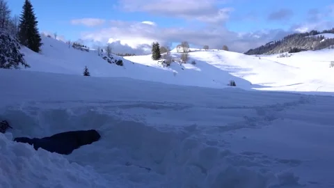 Person Digging a Pile of Snow from the Inside and Tossing Snow Outside on Stock Footage 205838346