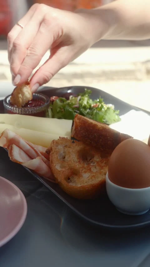 Person Dipping Piece of Toasted Bread into Sauce Stock Footage 339275539