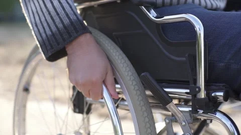 A person with a disability walking in the park Stock Footage 229714613