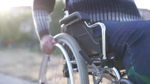 A person with a disability walking in the park Stock Footage 274547570