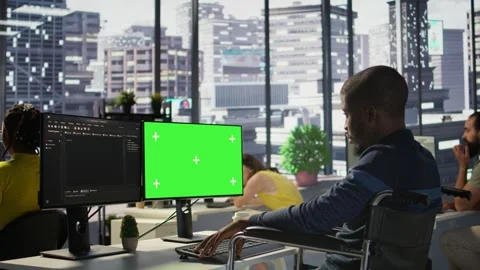 Person with disability in wheelchair checking code on mockup PC Stock Footage 318228942