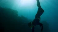 A Person Diving Underwater Stock Footage