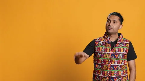 Person doing calm down sign gesturing, studio background Stock Footage 274763666