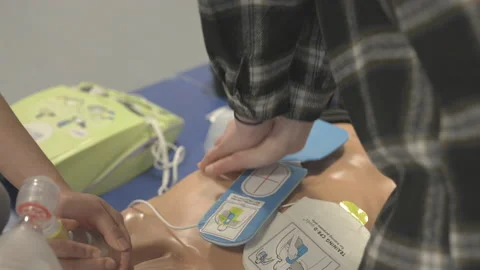 Person Doing Chest Compression Thrusting In An Up And Down Movement Stock Footage 154952106