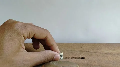 Person donating US dollar banknote into a charity box, concept of generosity. Stock Footage 331346277