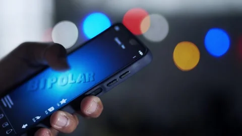 Person doom scrolling on smartphone at night Video stock 344757484