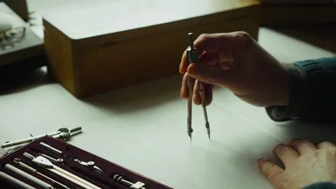 Person Drawing Perfect Circle with Compass, Technical Precision in Ambient Light Stock Footage 334718768