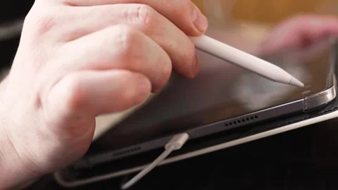 Person drawing on a tablet. Technology concept. Stock Footage 300760882