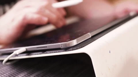 Person drawing on a tablet. Technology concept. Video stock 300761131