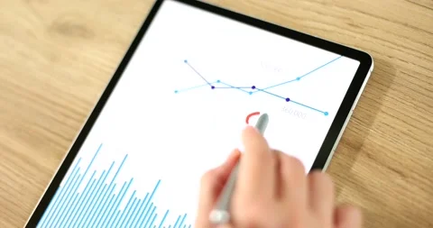 Person draws question marks on charts analyst tablet computer Stock Footage 215716457