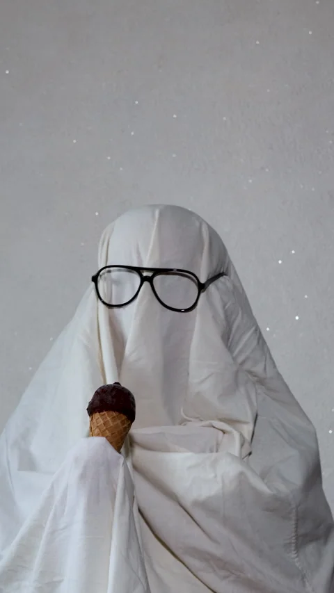 A person dressed in a simple ghost costume made from a white bedsheet, wear.. Stock Footage 314747705