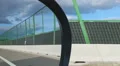 Person driving car, objects on the road reflected in side view mirror. Traveling HD Footage