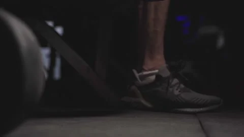 Person dropping dumbbell after workout in a gym Stock Footage 137380946