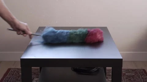 Person dusting a table with a brush Stock-Footage 44830693