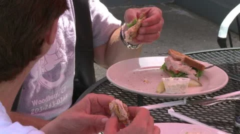 Person eating a Club Sandwich (2 of 2) Stock Footage