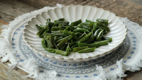 Person eating cooked green beans. Healthy food Stock Footage 340334155