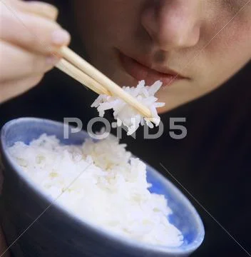 Using chopsticks to eat rice discount