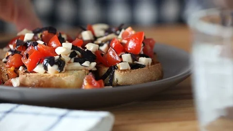 The person eats bruschetta. Stock Footage 91729599