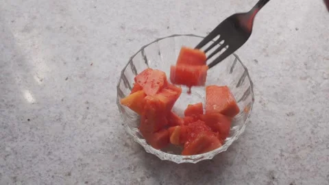 A person eats papaya close-up Stock Footage 249340302