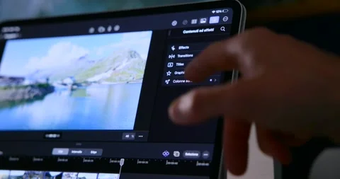Person Editing Video On iPad Pro With Final Cut Pro Video stock 343931312