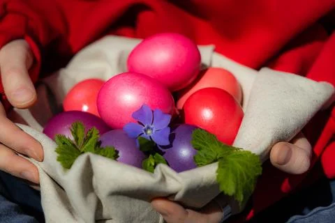 A Person Embracing a Rainbow of Easter Eggs Stock Photos