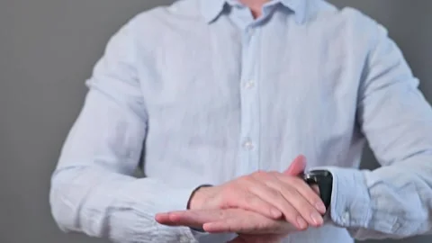A person engages in a hand trick, skillfully spinning an object on their wrist. Stock Footage 338300154
