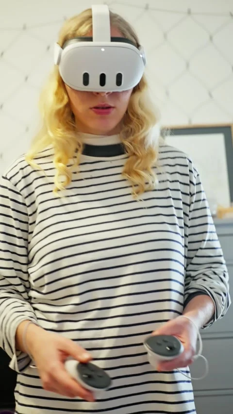 A Person Engaging in Exciting Virtual Reality Technology Right Within Their Own Stock Footage 303490408