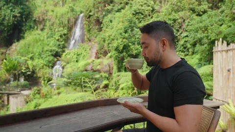 Person Enjoy Coffee While Admiring Beautiful Waterfall Lush Tropical Forest Bali Stock-Footage 344834074