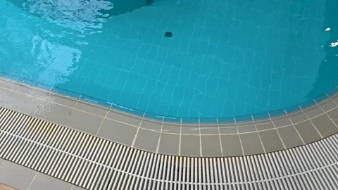 Person enjoying a fun day in a pool with a frisbee, great for summer or vac.. Stock Footage 345988841