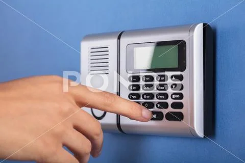 Person Entering Code In Security System Stock Photos