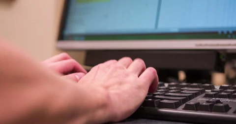 Person entering data in at computer 4k Stock Footage