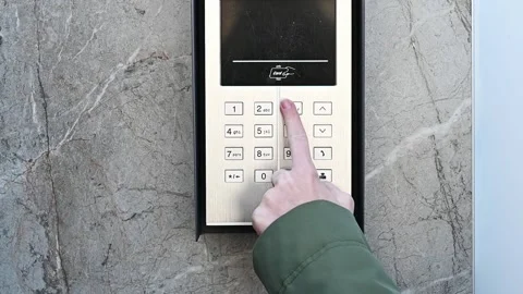 Person entering security code on keypad access control system. Stock Footage 305440096