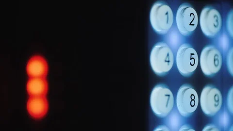 A person enters a pin code on a backlit keyboard 動画素材 129290411